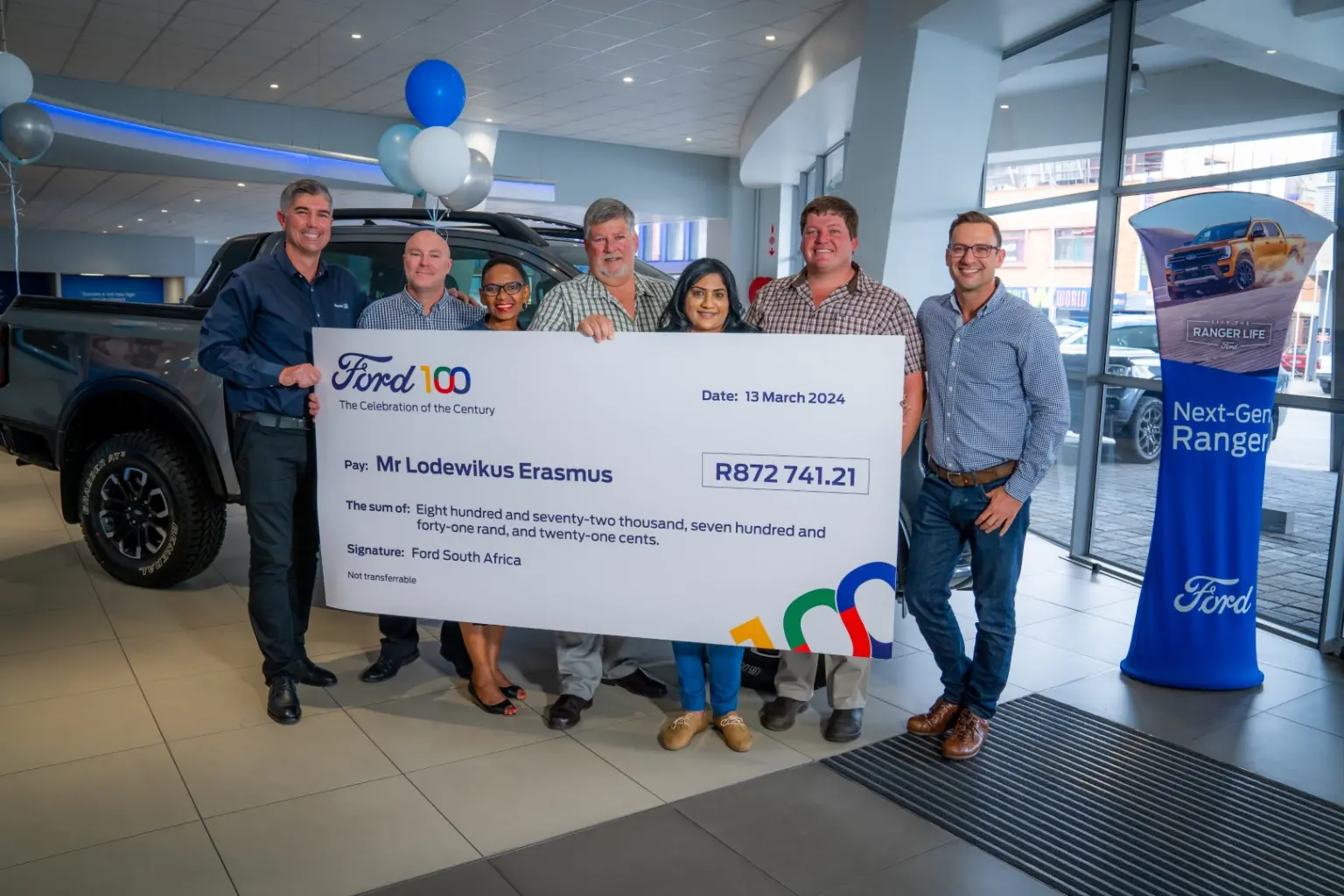 Left to right: Des Williams (Dealer Principal at Human Auto Bloemfontein), Dale Reid (Regional Sales Manager), Doreen Mashinini (General Manager for Marketing) Lodewikus Erasmus (Winner) Alisea Chetty (General Manager Retail Sales), Le Roux Erasmus (Lodewikus’ son), Hanno Botha (Marketing Communications Manager)